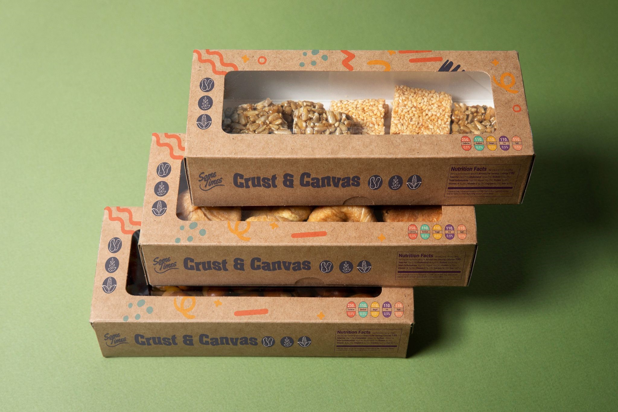Kraft packaging boxes with clear window, stacked to display assorted baked goods in sustainable food packaging
